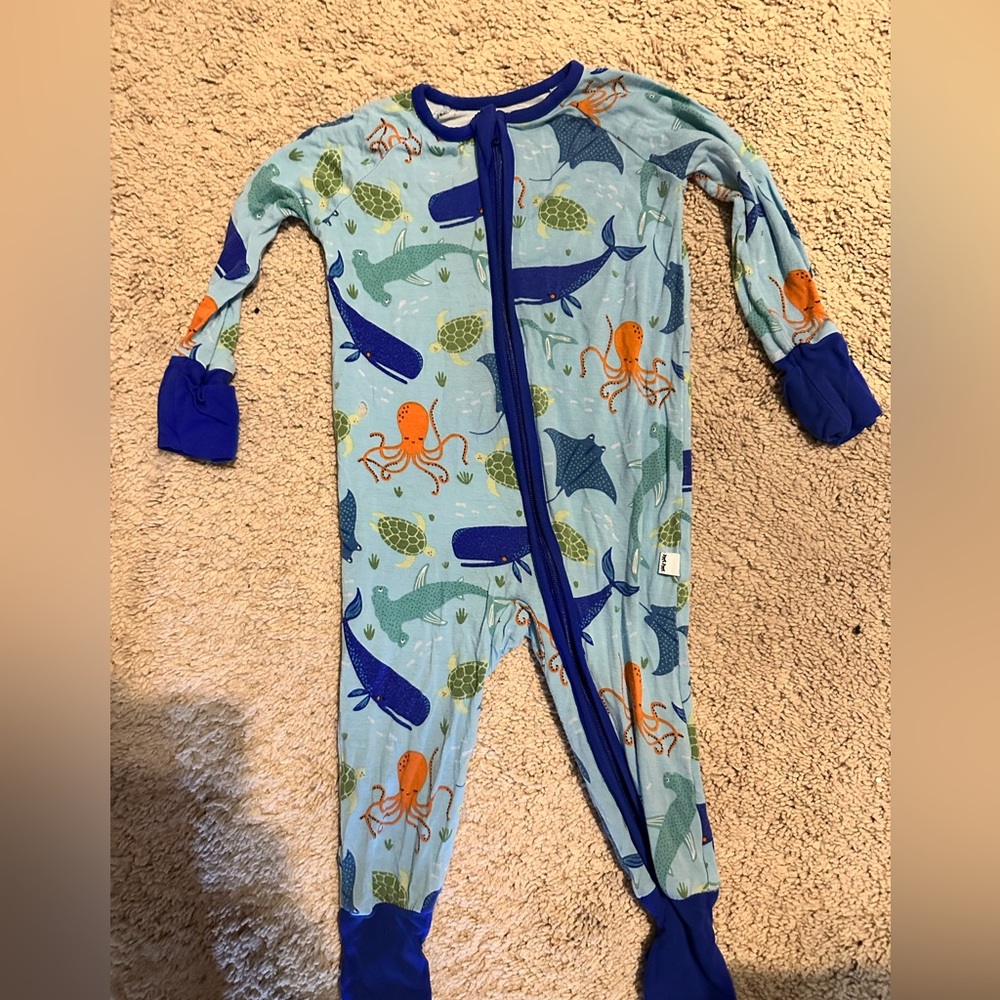 Little sleepies 3-6 months ocean.  DEFECT/small hole pictured